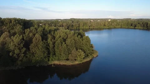 Calm Morning Drone Flight Over Lake with Water Reflections Stock Footage 328521916