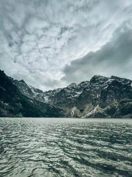 Calm Mountain Lake Under Dramatic Sky Stock Photos
