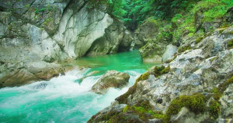 Calm mountain river with turquoise water in a narrow gorge at rainy day. Rapid Stock Footage 253177798