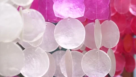 Calm movement of translucent capiz shell hanging decoration Stock Footage 334718291