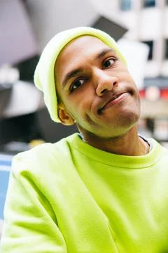 Calm multiracial man looking at camera on city street Foto stock