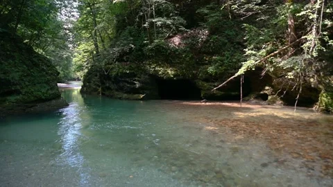 Calm narrow river flowing through glacial canyon Stock Footage 137450270