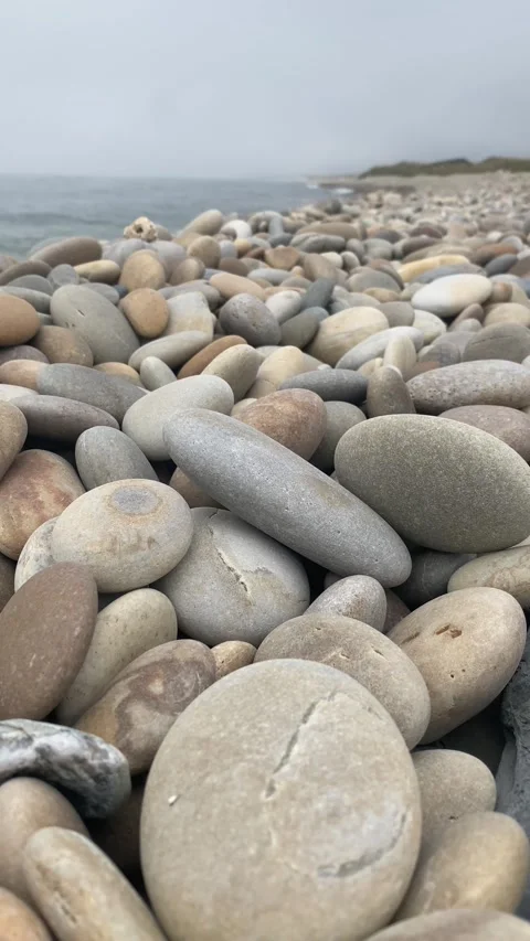 Calm Ocean Beach with Pebbles Rolling into Water 🌊 – Peaceful Nature Stock Footage 311110566