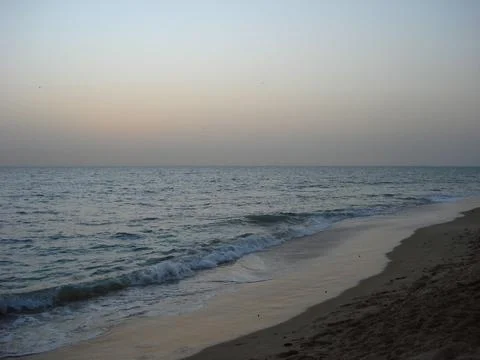 Calm ocean at dusk Stock Photos