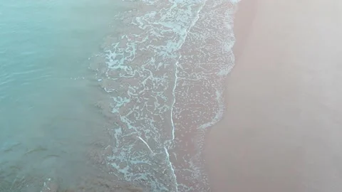 Calm ocean foam wave reaching exotic sunrise sandy beach Stock Footage 147247011