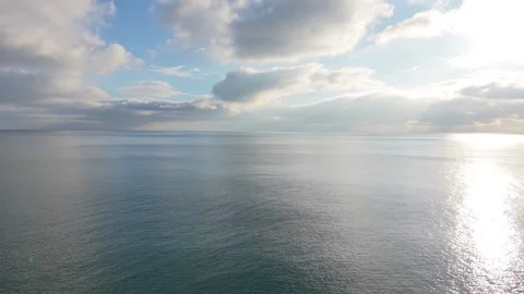 Calm Ocean Horizon with Clouds and Reflections Aerial Drone View Stock Footage 327840428