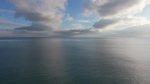 Calm Ocean Horizon with Clouds and Reflections Aerial Drone View Stock Footage 327840433