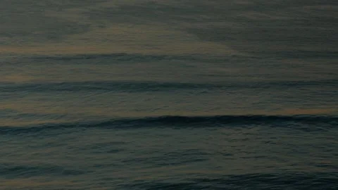 Calm ocean with small waves during sunset Stock Footage 304002910