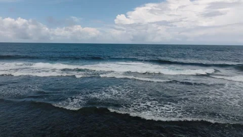 Calm ocean with small waves under cloudy sky. Siargao, Philippines. Stock Footage 343424699