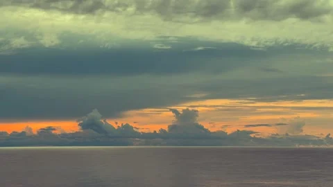 Calm Ocean at Sunset with Dramatic Clouds in the Sky Stock Footage 338281756