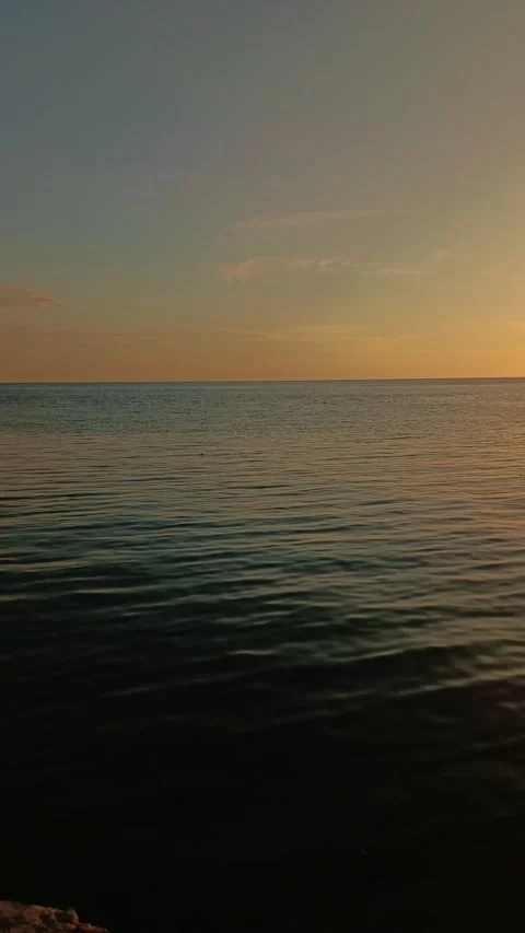 Calm Ocean at Sunset in Vertical Orientation Video stock 325830187