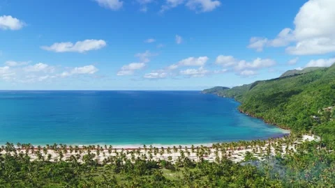 Calm ocean surface and idyllic sandy natural tropical island. Stock Footage 242138901
