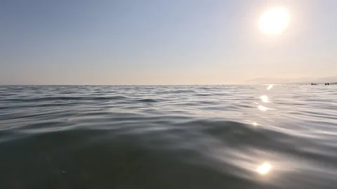 Calm ocean surface with sunlight reflections Stock Footage 332064651
