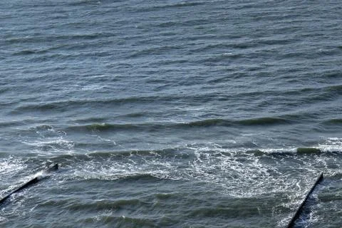 Calm ocean waters with hints of waves Stock Photos