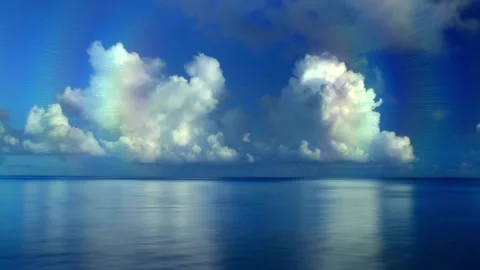Calm ocean wave landscape with beautiful blue sky wallpaper background HD Video stock 336579681