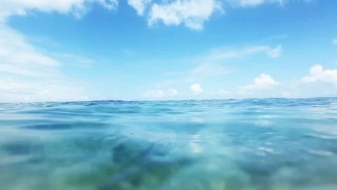 Calm ocean wave landscape with beautiful blue sky wallpaper background HD Stock Footage 336579764