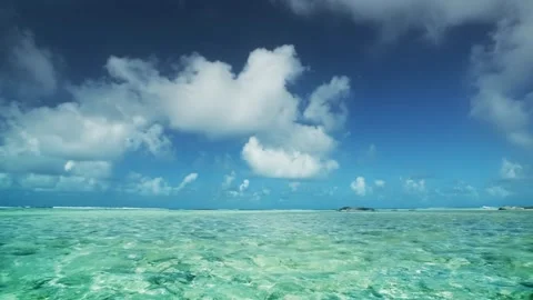 Calm ocean wave landscape with beautiful blue sky wallpaper background HD Stock Footage 336579788