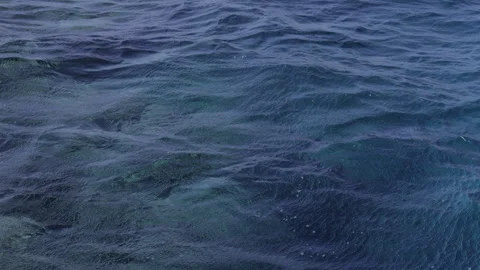 Calm Ocean Waves and Shimmering Depths. Slow motion. Stock Footage 322089253