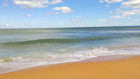 Calm ocean waves coming into the beach Stock Footage 299850438