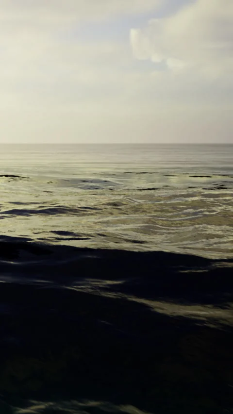 Calm ocean waves gently rolling towards the horizon during twilight hours Stock Footage 331832465