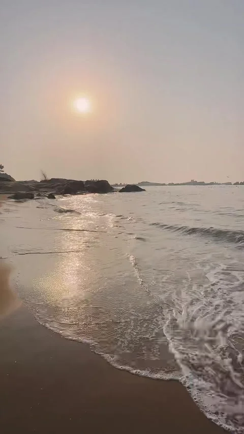 Calm Ocean Waves Lapping Sandy Beach at Golden Sunset Video stock 330096231