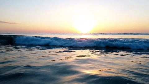 Calm Ocean Waves Moving Slowly at Sunrise 4K Stock Footage 331339907