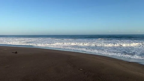 Calm Ocean Waves Rolling on Empty Black Sand Beach Stock Footage 274399557