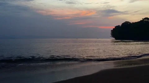 Calm Ocean Waves Rolling onto an Empty Tropical Beach at Sunrise Stock-Footage 347042000