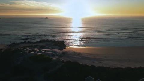 Calm ocean waves at sunset aerial footage South Africa Stock Footage 330879751