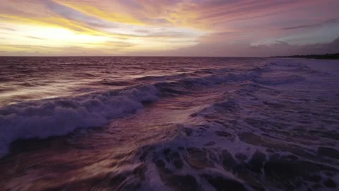 Calm Ocean Waves at Sunset with Cinematic Sky Track In &amp; Orbit Drone Movement 库存影片 237520882