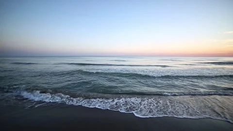 Calm Ocean Waves at Sunset Stock Footage 338131568