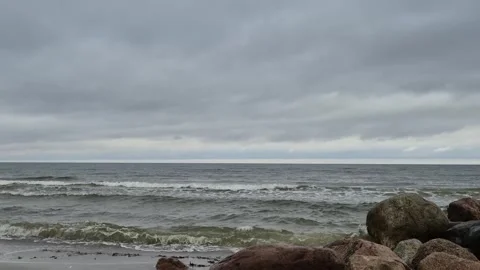 Calm Ocean Waves Under Cloudy Sky with Natural Sound Stock Footage 323462975