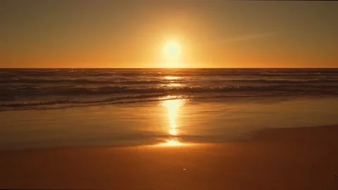 Calm paradise beach with waves at sunset Stock Footage 148633864