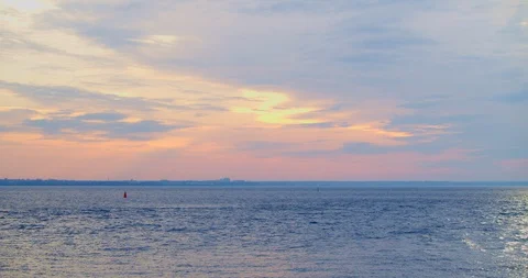 Calm peaceful soft landscape of the evening sky with clouds over the water. Stock Footage 127464144