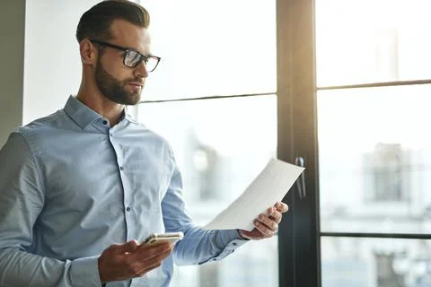 Calm person working with documents in the office Stock Photos