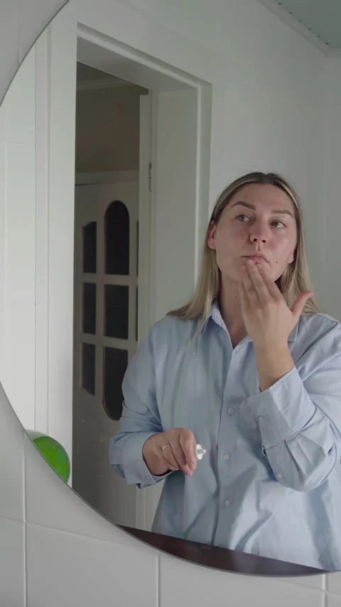 Calm Professional Applying Face Cream Before Virtual Job Interview Stock Footage 342053183