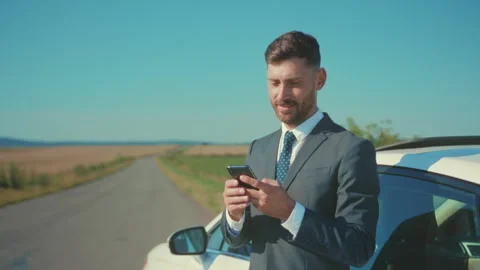 Calm professional using mobile device, Investor checks notifications calmly Stock Footage 334763071