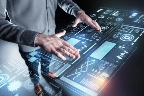 Calm programmer standing alone and controlling the program Stock Photos