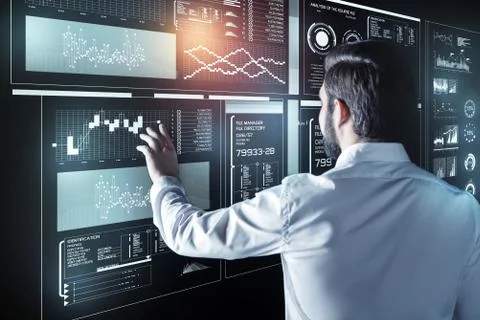 Calm programmer touching a futuristic screen while being at work 스톡 사진