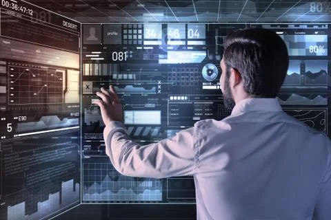 Calm programmer touching the screen while working alone Stock-Fotos