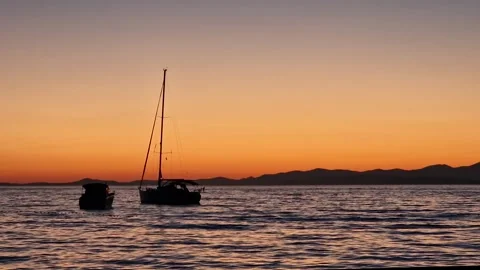 Calm relaxing established of sunset on the sea with silhouette of sail boat Video stock 307196653