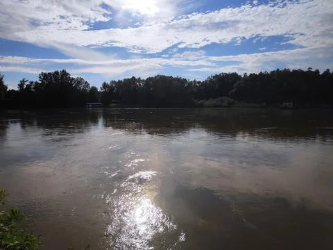 Calm River Beneath a Vast Open Sky Stock Photos