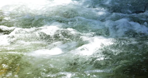 Calm river current with sparkling sunlight and smooth water motion inslow motion Vídeos de archivo 335731648