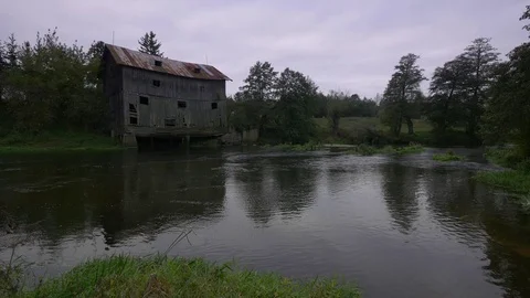 Calm river during cloudy, autumn day. UHD footage.  Stock-Footage 70468876