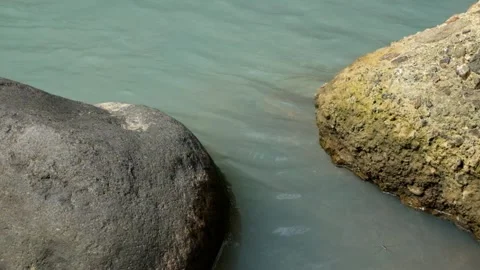A calm river flowing between two rocks Stock Footage 336828570