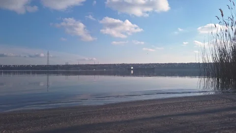 Calm River Landscape with Waves Moving Slowly and a Ship in a Distance Stock Footage 124582020