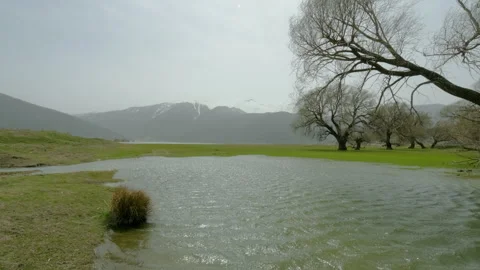 Calm River with Mountain View Stock Footage 282935678