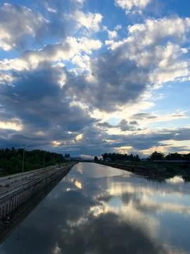 Calm River Reflecting Dramatic Clouds 스톡 사진