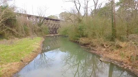Calm River Stream ducks swim rail road bridge Drone fly Stock Footage 85359157