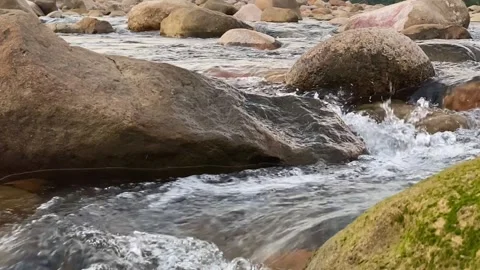 Calm river stream through rocks at bichanakandi, sylhet, bangladesh Stock Footage 329528815